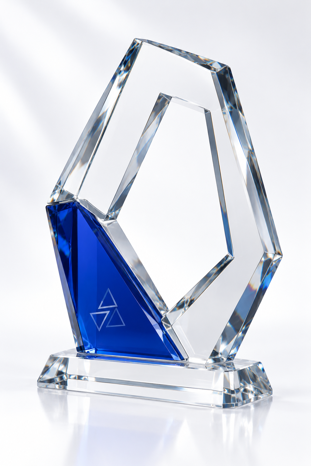 Angular open-frame crystal-glass trophy with a cobalt blue accent