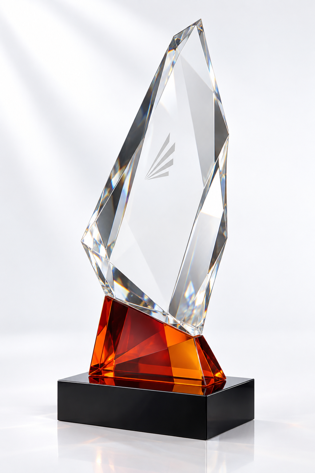 Asymmetric faceted clear glass award with red-orange glass accent and black plinth