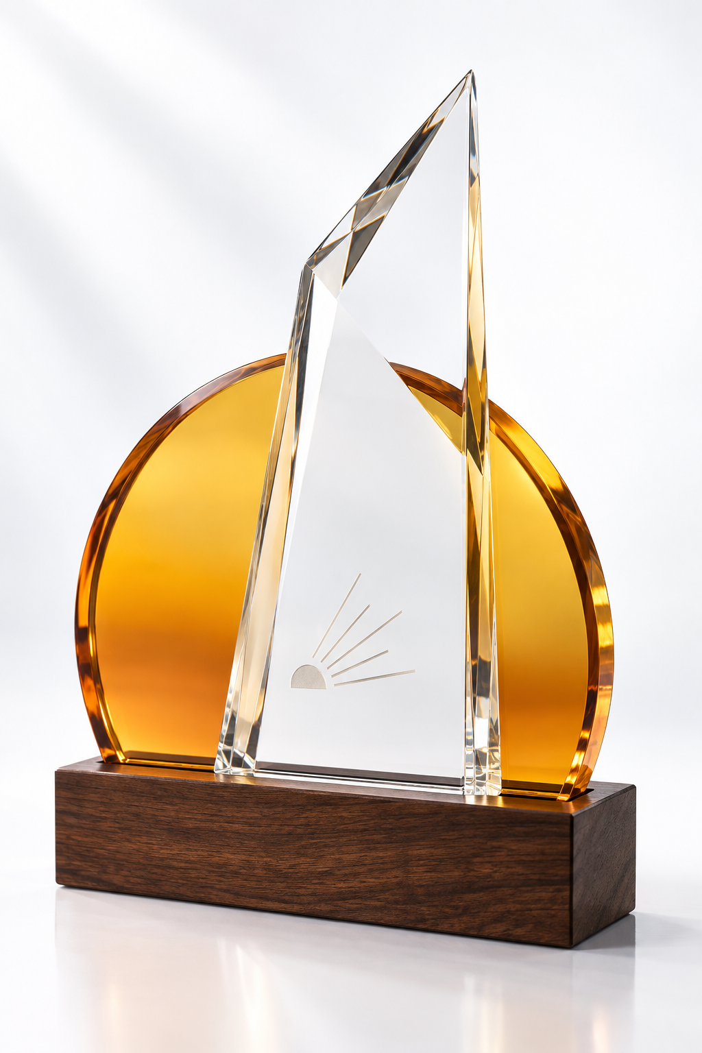 Amber half-disc and clear faceted glass award on a dark wood base